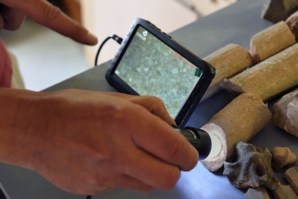 France, Bas Rhin, Strasbourg, old town listed as World Heritage by UNESCO, workshops of the Oeuvre Notre-Dame Foundation, conservation workshop, portable microscope to see the composition of sandstone