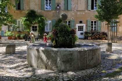 France, Herault, Villeneuvette, former Royal factory, the fountain on the place Louis XIV set up for the washerwomen