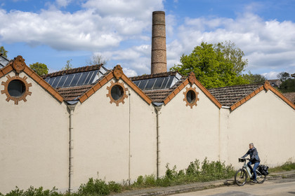 France, Vendee, Mallièvre, the Vendée Vélo Tour cycle route passes in front of the Couleurs et Textiles factory which symbolizes the city's weaving industrial history