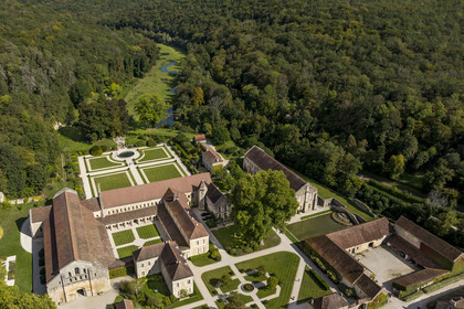 France, Cote d'Or, Marmagne, the Cistercian Abbey of Fontenay founded in 1118, listed as World Heritage by UNESCO, the valley of the ru (stream) of Fontenay in the background (aerial view)