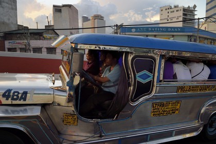 Philippines, Luzon island, Manila, jeepney (elongated jeep to transport passengers) at the entrance Quezon Bridge