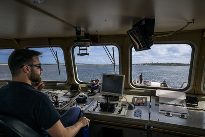 France, Finistère, Iroise Sea, Molene Island, Penn ar Bed boat connecting with the islands of Molene and Ouessant, arrival on the Island of Molène seen from the bridge with the pilot