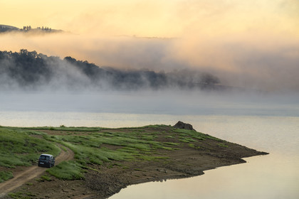 France, Nievre, Regional Natural Park of Morvan, Chaumard, Pannecière lake in the early morning mist