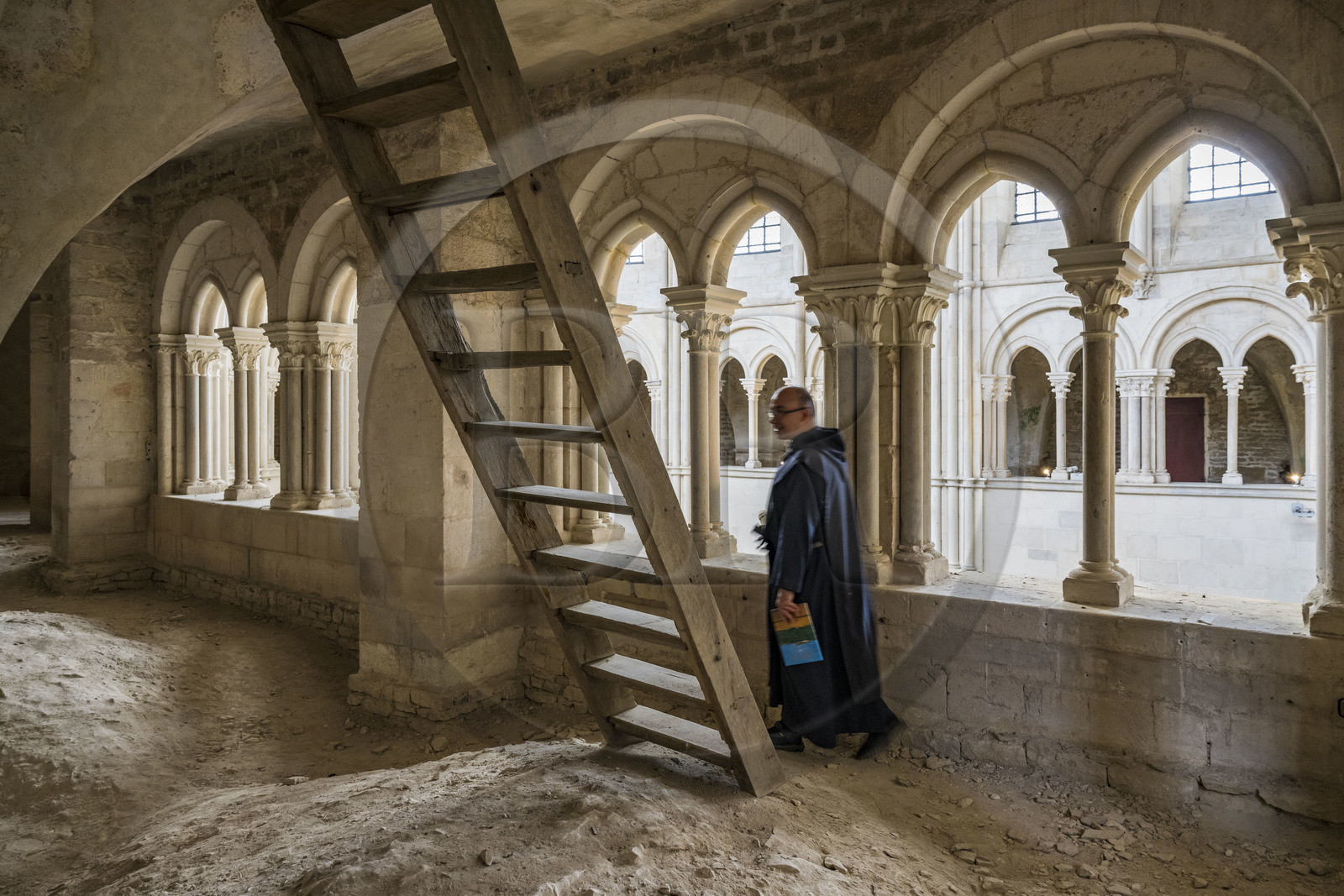 France, Yonne, regional natural park of Morvan, Vézelay, a UNESCO World Heritage site, labelled Les Plus Beaux Villages de France, starting point of one of the main ways to Santiago de Compostela, the Basilica of Saint Mary Magdalene, Brother Matteo of the Jerusalem Fraternity in black tunic and chasuble in the galleries overlooking the choir
