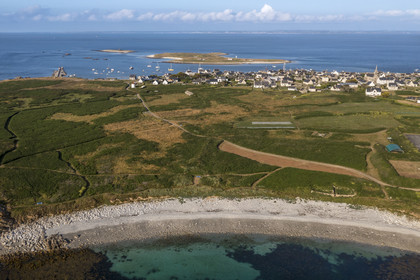 France, Finistère, Iroise Sea, Molene archipelago, Molene Island, Toul Bili beach, the town and the Lédenez Vraz islet in the background (aerial view)