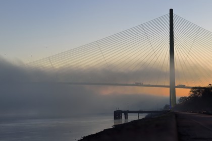 France, between  Calvados and Seine Maritime, the Pont de Normandie (Normandy Bridge) in the mists of dawn, it spans the Seine to connect the towns of Honfleur and Le Havre