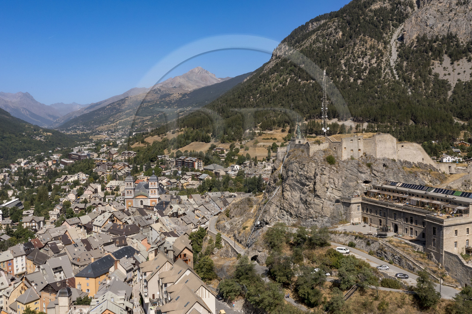 France, Hautes Alpes, Briancon, Vauban site listed as UNESCO World Heritage, the Fort du Chateau overlooking the old town within the citadel with the bell towers of the Notre-Dame-et-Saint-Nicolas collegiate church (aerial view)