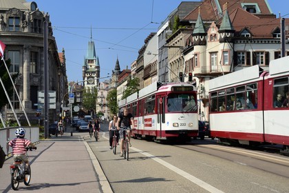 Germany, Baden-Wurttemberg, Freiburg im Breisgau, tram on the street Kaiser-Joseph Strasse and the Martinstor one of the original city gates in the background