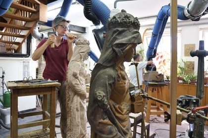 France, Bas Rhin, Strasbourg, old town listed as World Heritage by UNESCO, sculpture and stonemasons' workshops of the Oeuvre Notre-Dame Foundation, the sculptor Nathalie Masson making a copy of a statue of St. Richarde