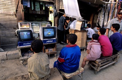 Egypt, Cairo, video-games played in a street of the old Muslim city