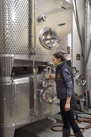 France, Bas Rhin, the Alsace Wine Route, Nothalten, Wine estate Philippe Sohler, fermentation tank, viticulturist Lydie Sohler