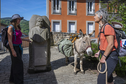 France, Haute-Loire (43), Le Monastier-sur-Gazeille, hiking with a donkey on the Robert Louis Stevenson Trail (GR 70), bust of Robert Louis Stevenson (1850-1894) by sculptor Lucie Delmas