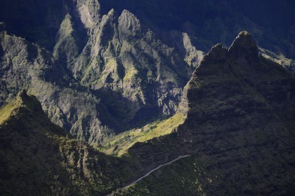 France, Reunion island (French overseas department), cirque of Cilaos, listed as World Heritage by UNESCO, tunnel exit to access Cilaos behind the village of Palmiste Rouge (aerial view)
