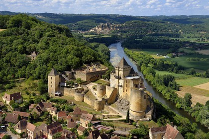 France, Dordogne, Perigord Noir, Dordogne Valley, Castelnaud la Chapelle, labelled Les Plus Beaux Villages de France (The Most Beautiful Villages of France), Castelnaud Castle on a cliff above the Dordogne valley (aerial view)