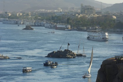 Egypt, Upper Egypt, Nubia, Nile Valley, Aswan, felucca and cruise ship on the Nil, the port in the background