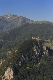 France, Ariege, Pays d' Olmes, Cathar Castle of Montsegur perched on a rock and the Pyrenees (aerial view)..