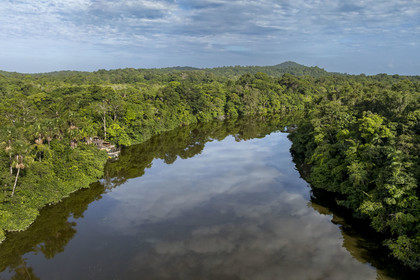 France, French Guiana, Kourou, the carbet (shelter) at Camp Maripas on the banks of the Kourou river, Monkey Mountain (161 meters high) in the background (aerial view)