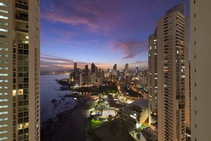 Panama, Panama City, waterfront skyscrapers of Punta Paitillia district after sunset