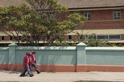 Zimbabwe, Harare, schoolchildren in uniform in front of the Dominican Convent High School founded in 1892 on Simon Muzenda street