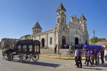 Nicaragua, Granada, traditional hearse drawn by two horses for a funeral at the church of Guadalupe
