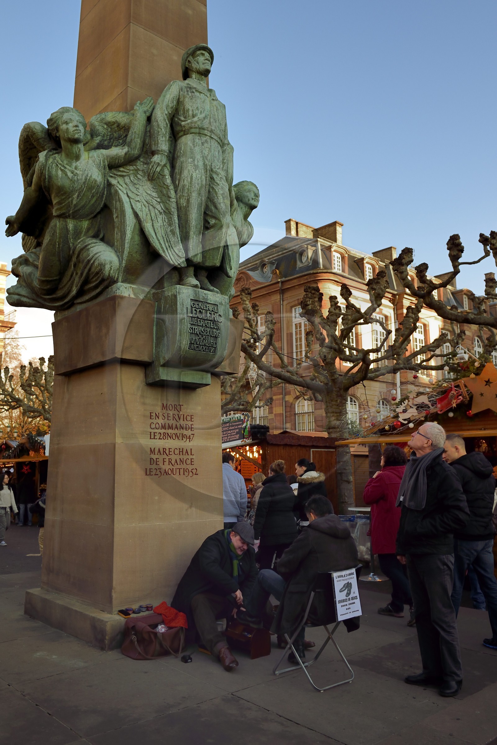 France, Bas Rhin, Strasbourg, old town listed as World Heritage by UNESCO, shoeshine  man at the foot of the monument to General Leclerc on the place Broglie