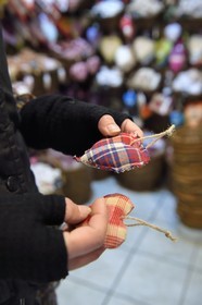 France, Haut Rhin, Strasbourg, Kaysersberg, Falile Martin in her shop Le Grenier Enchanté offers fabric Christmas hearts