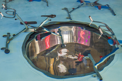 France, Herault, Montpellier, Port Marianne district, Le Nuage building by designer Philippe Starck, aquabike center in the pool upstairs, above the Avva Garden restaurant visible through two large portholes