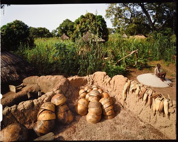Burkina Faso, Poni province, Lobi land, Loropéni, calabash for dolo (sorghum or millet beer) on the roof of a house, it has the characteristic of refreshing the drinks it contains