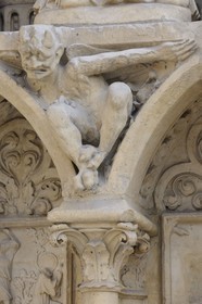 France, Paris, ile de la Cite, Notre-Dame Cathedral, the Portal of the Virgin, small devil with his horns under Saint-Genevieve