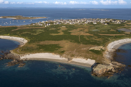 France, Finistère, Iroise Sea, Molene archipelago, Molene Island, the Roelen shore, the town and the Lédenez Vraz islet in the background (aerial view)