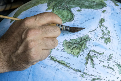 France, Charente, Cognac, handcrafted terrestrial globe painted in watercolor by Gabriel Gaborel creator of OrbisTerrae
