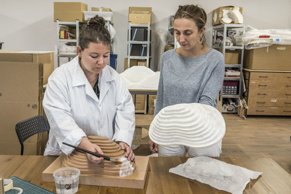 France, Gard, Bagard, Atelier Sericyne, production of exceptional and non-woven silk for the creation of decorative and lifestyle objects in silk, placement of a piece of silk threads on a mold with brush and water application, Hélène Gauthier in charge of production and the founder Clara Hardy on the right