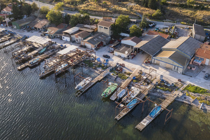 France, Hérault, Bouzigues, village on the banks of the Etang de Thau and renowned for its oysters and shellfish, oyster farms (aerial view)