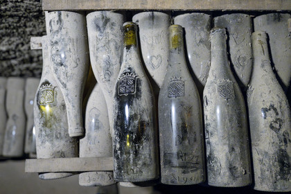 France, Cote d'Or, Climats terroirs of Burgundy listed as World Heritage by UNESCO, Beaune, the cellars of Maison Patriarche, a wine merchant-breeder company, the oldest bottles are gathering dust