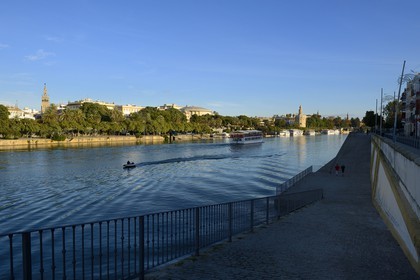 Spain, Andalusia, Seville, Guadalquivir river Banks, the Giralda  left and the Golden Tower (Torre del Oro) right