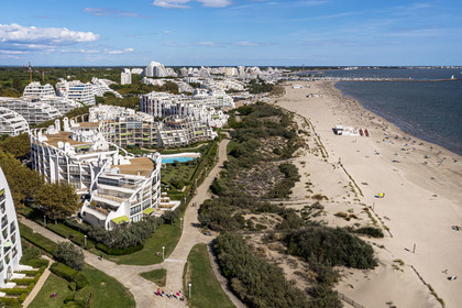 France, Herault, La Grande-Motte, labeled 20th century heritage, Couchant (setting sun) district west of the port and the beach (aerial view)