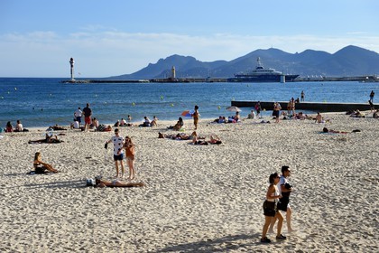 France, Alpes-Maritimes, Cannes, the Croisette beach and the massif des Maures in the background