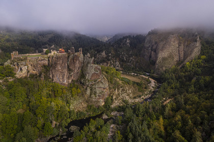 France, Haute Loire, Loire river Valley, Arlempdes, labelized the Most Beautiful Villages of France, ruins of the castle perched on a basalt rock (volcanic dyke) overlooking a Loire river meander (aerial view)