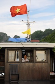 Vietnam, Quang Ninh Province, Halong Bay, listed as World Heritage by UNESCO, capitaine of a chinese cruse junk
