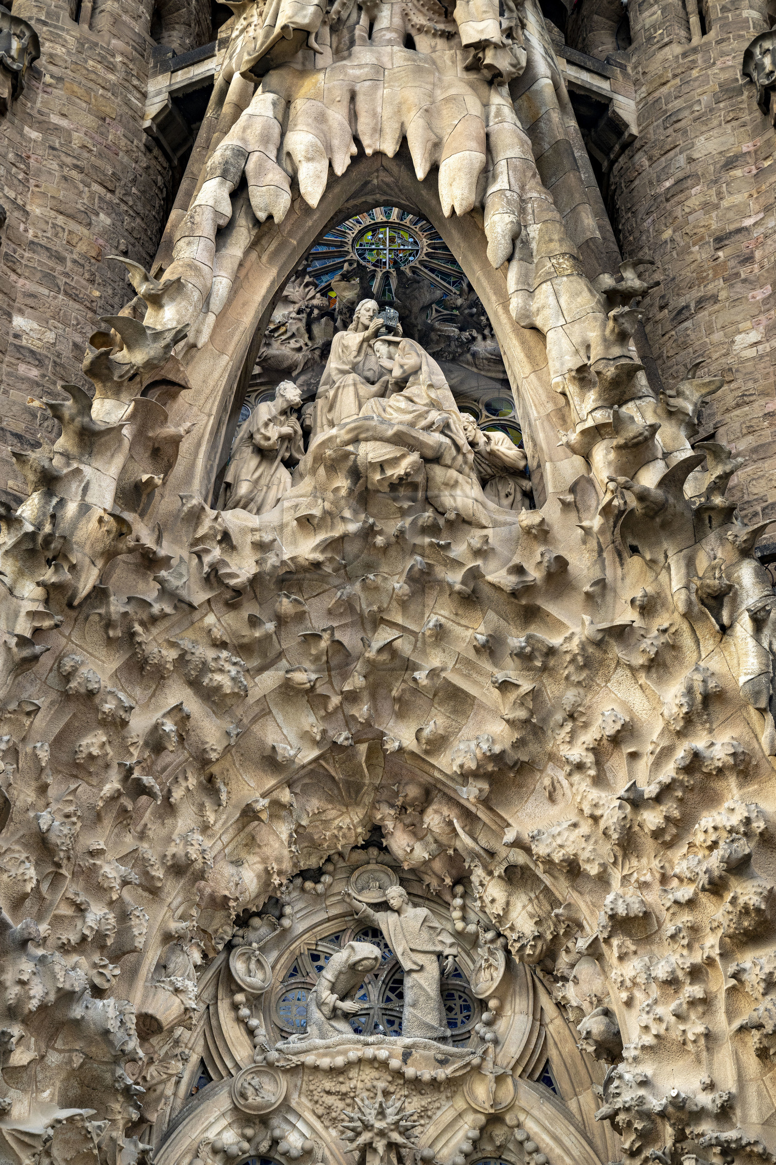 Spain, Catalonia, Barcelona, Eixample district, Sagrada Familia basilica by Catalan modernist architect Antoni Gaudi, listed as a UNESCO World Heritage Site, facade of the Nativity and the coronation of Mary