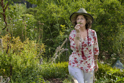 France, Alpes-Maritimes, Mouans-Sartoux, Gardens of the International Museum of Perfumery (Musée International de la Parfumerie - MIP), Corinne Marie-Tosello, a nose designer of olfactory workshops, smells of bergamot mint