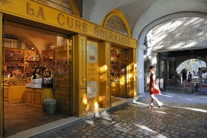 France, Gard, Uzes, listed as town of art and history, the weekly market in the Place aux Herbes surrounded by arcaded houses and outdoor cafes