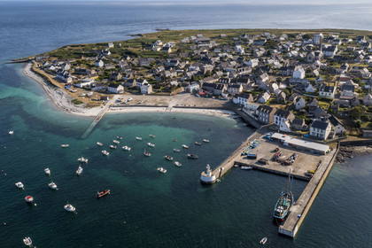 France, Finistère, Iroise Sea, Molene archipelago, Molene Island, the town and the ship Notre-Dame de Rumengol former barge at the quayside in the port (aerial view)