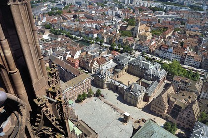 France, Bas Rhin, Strasbourg, old town listed as World Heritage by UNESCO, Notre Dame Cathedral, place du Chateau with the Palais Rohan (Rohan Palace) in the center and the Oeuvre Notre-Dame Foundation right in the foreground, the quai des Bateliers transformed into pedestrian meeting area and the Sainte Madeleine church in the background