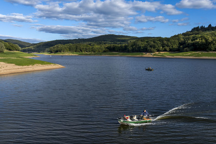 France, Nievre, Regional Natural Park of Morvan, Chaumard, Pannecière lake, Jean-Bernard Dioux, vice-president of the AMC, the Morvan Carnassier Association, goes fishing on a boat (aerial view)