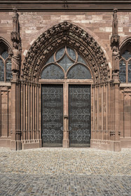 Switzerland, Basel, the Minster or Protestant Cathedral of Our Lady of Basel (Munster), to the left of the main portal, Emperor Henry II carries a model of a church in his arms, which identifies him as the benefactor of this construction