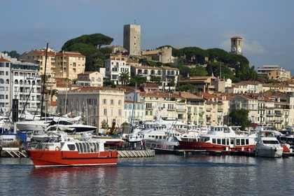 France, Alpes-Maritimes, Cannes, the harbour and the old town in Le Suquet district, at its peak the Tour du Suquet and the steeple of the Notre-Dame-de-l'Esperance church