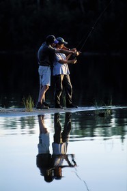 Canada, Quebec Province, La Verendrye Wildlife Reserve, Lake Victoria, couple fishing at sunset