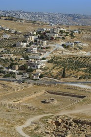 Israel, West Bank, Herodium or Herodion is a volcano-like hill with a truncated cone with a a fortress and palace build by Herod the Great (Herodion National Park), remains of the palace of the lower Herodium and its basin, in the distance Bethlehem