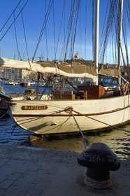 France, Bouches du Rhone, Marseille, the Vieux Port, the Marseille sailboat and Notre Dame de la Garde in the background